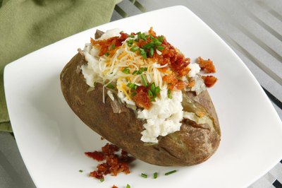 Baked potato with an assortment of toppings.