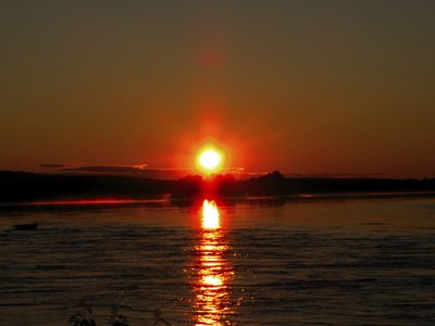 Red, setting sun over the ocean