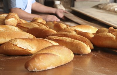 A baker makes fresh bread.