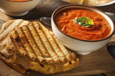 Grill cheese sandwich with tomato soup.
