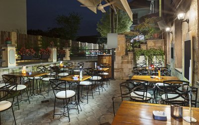Relaxed Southern restaurant with wooden tables and New Orleans-inspired chairs.
