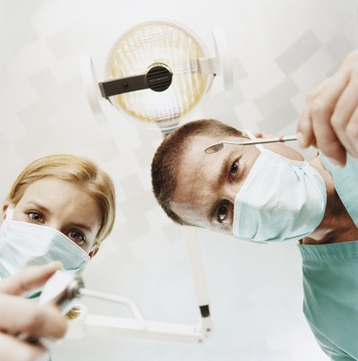 Dentist and assistant.