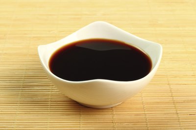 A bowl of soy sauce.