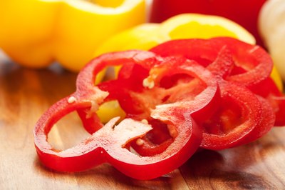 Sliced red bell pepper on a cutting board.
