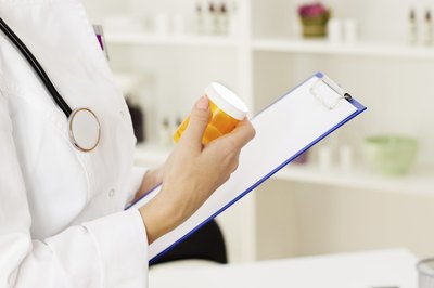 Doctor writing prescription.