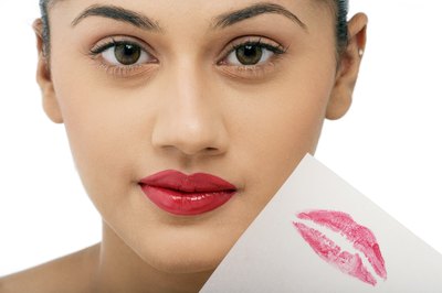 woman with lipstick mark on paper