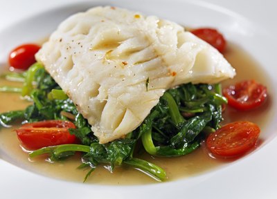 Halibut filet served over vegetables