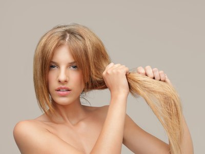 Woman with long, dry hair.