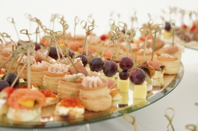 Various cheese and seafood appetizers on serving dish