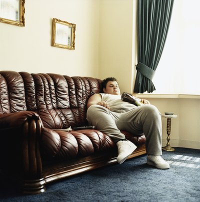 Overweight man on sofa