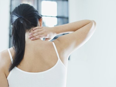 Woman holding neck