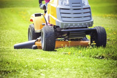 Close-up of a lawn tractor mowing grass