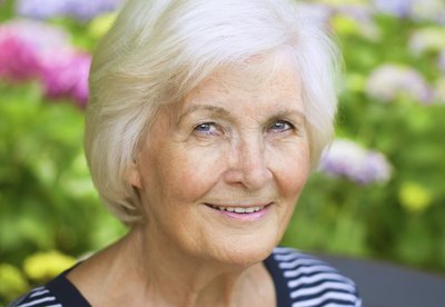 Woman with white hair.