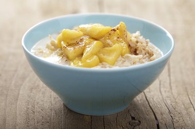 A bowl of oatmeal with caramelized apples.