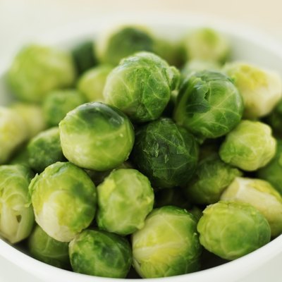 A bowl of fresh Brussels sprouts.