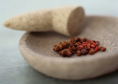 Use a mortar and pestle to crush pills
