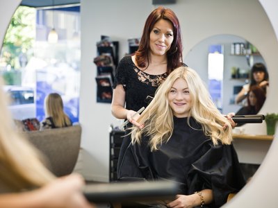 stylist and customer in hair salon