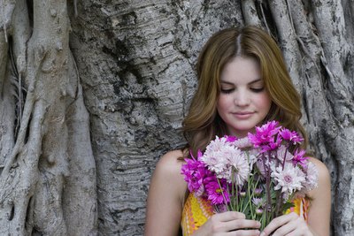 Young woman holding bouquet of flowers