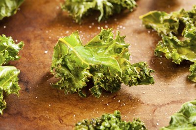 A close-up of Kale chips with sea salt.