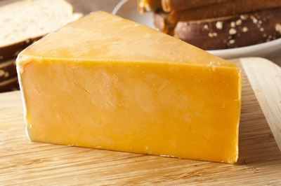 block of sharp cheddar cheese