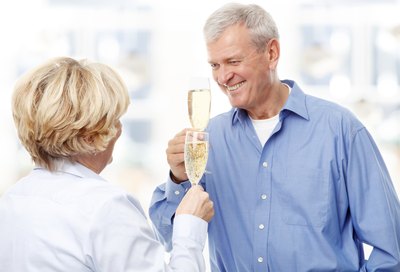 Senior couple toasting champagne