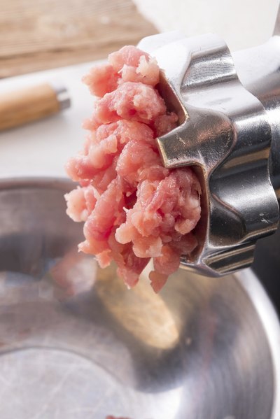 Pork goes through meat grinder