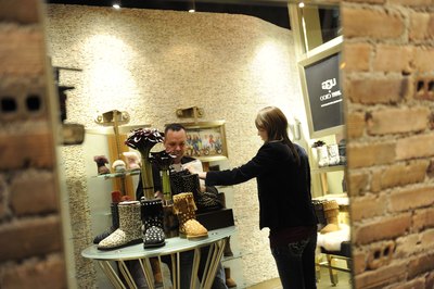 Shopper looking at Ugg boots in store