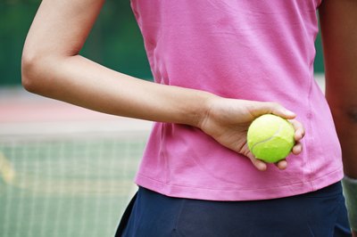 Put the tennis ball on the pressure points of the back.