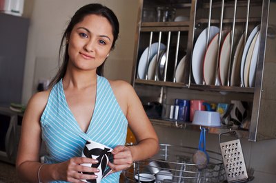 woman with glass in kitchen