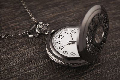 Pocket watch on wood table