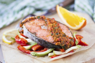 Smoked fish served over vegetables.