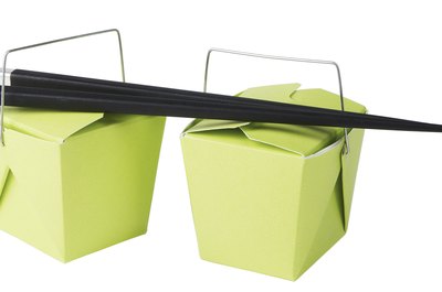 Photos.com/PhotoObjects.net/Getty Images A green food container should be made from renewable material and break down quickly in a composting facility.