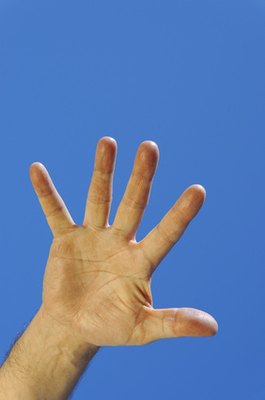 hand image by Alexey Klementiev from Fotolia.com "Down" is often signaled with a hand above the head.