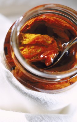 John Foxx/Stockbyte/Getty Images Sun dried tomatoes do not pose a risk to dogs in small amounts.
