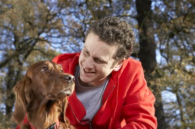 Michael Blann/Digital Vision/Getty Images Take your dog outdoors to help prevent the spread of vitiligo.
