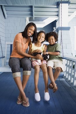 Jupiterimages/Brand X Pictures/Getty Images The new puppy needs a place to hang out where he's safe.