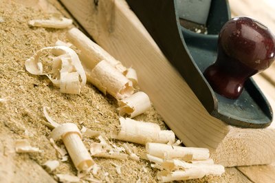 Jupiterimages/liquidlibrary/Getty Images Pine shavings are soft and absorbent, but may pose a danger to puppies.