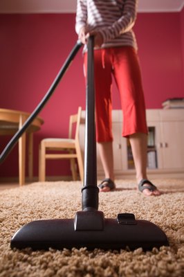 Jupiterimages/Photos.com/Getty Images Your dog may perceive the vacuum to be a threat to you both.