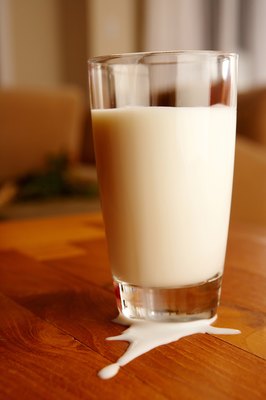 Jupiterimages/Photos.com/Getty Images Cow's milk is never a good idea for puppies.