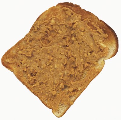 George Doyle/Stockbyte/Getty Images A dog might prefer smooth or crunchy peanut butter.