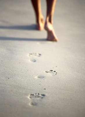 Steve Mason/Photodisc/Getty Images Walking barefoot in areas with infected dog feces increases the risk of hookworms.