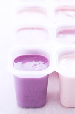 Martin Poole/Digital Vision/Getty Images Choose plain unsweetened yogurt for your pup.