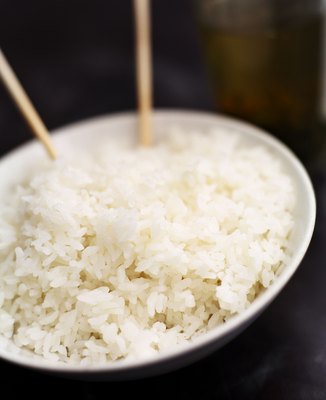 NA/Photos.com/Getty Images Plain white rice and chicken are both low residue foods easy for your dog to digest.