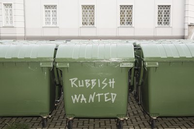 Image Source/Photodisc/Getty Images A wheeled plastic trashcan, cut to size, makes an ideal dog bath.