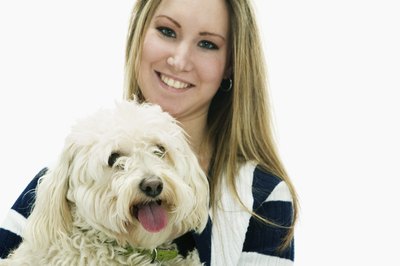 Jupiterimages/Brand X Pictures/Getty Images Your pooch understands and appreciates physical displays of your affection.