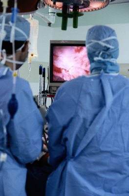 Keith Brofsky/Photodisc/Getty Images Like humans, dogs with enlarged hearts can suffer several complications during surgery.