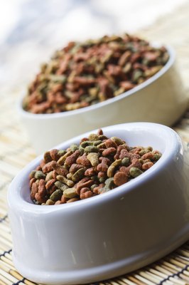 tiverylucky/iStock/Getty Images Dog foods must contain certain macronutrients and micronutrients--including copper -- to be determined "complete and balanced."
