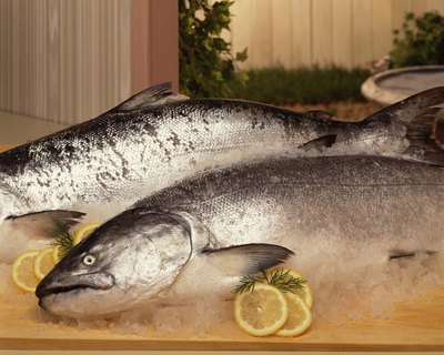 Jupiterimages/Comstock/Getty Images Cooked salmon is easy to add to your dog's dry food.