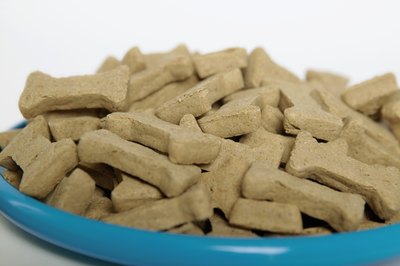 Jupiterimages/liquidlibrary/Getty Images Make these crunchy soup and rice biscuits for your favorite pooch.