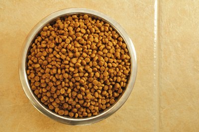 Chalabala/iStock/Getty Images Hanging a dog bowl reduces accidental spills and messes.